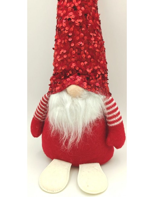 Manó flitteres sapkában