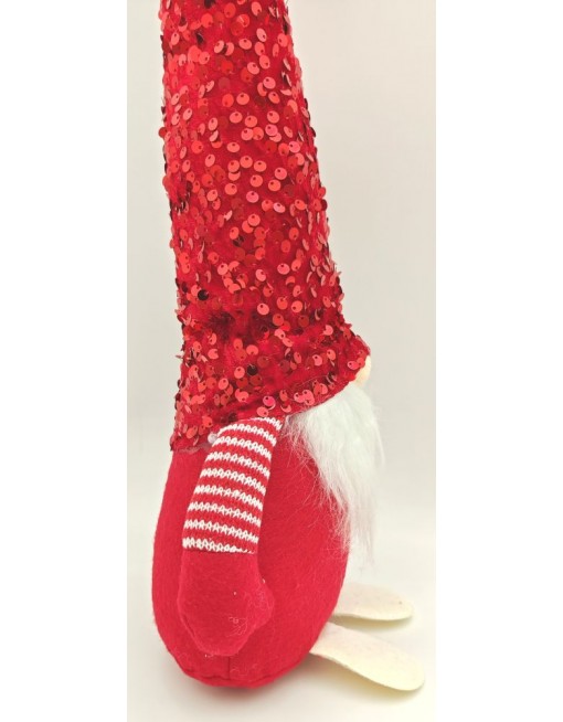 Manó flitteres sapkában