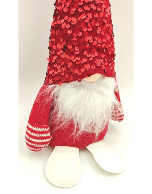 Manó flitteres sapkában